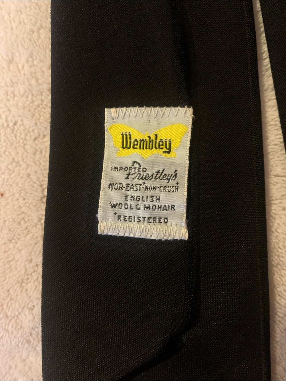Wembley Black Wool-Mohair Necktie with Yellow Logo Tag